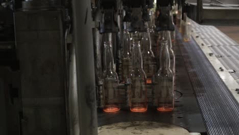 automatic bottle production machine in a glass factory