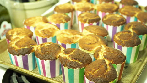 freshly baked muffins sitting on the top of a stove, ready to be eaten