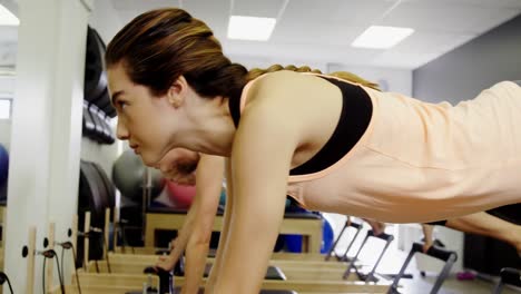 Beautiful-women-exercising-in-fitness-studio