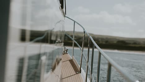 deck and railing of boat rocking in sea, slow motion