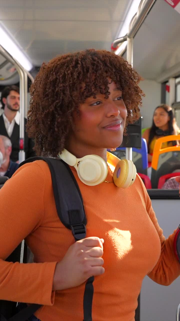 Woman with Headphones on a Bus