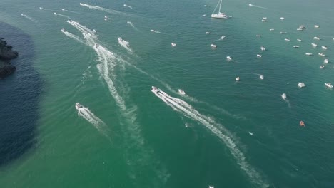 Tracking-aerial:-Several-boats-round-a-point-in-green-Knysna-Lagoon