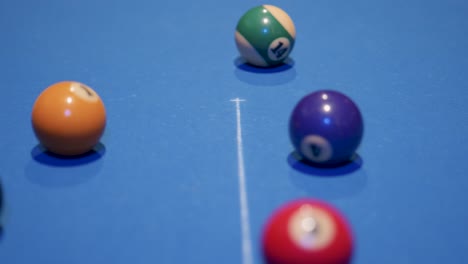 white ball starting snooker game hitting the colored balls