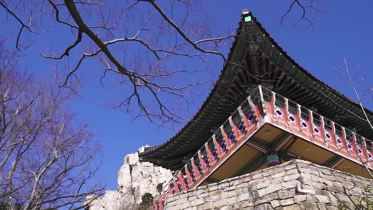 A panning shot of buddhist temple in South Korea during winter (shoot info: Cin2, 1080p, 23.97fps slowmotion from 59.94fps)