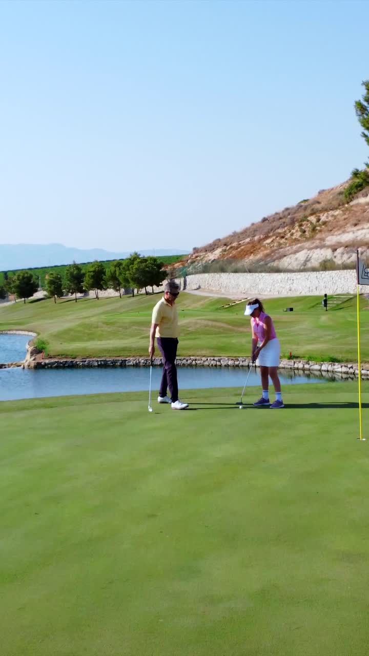 People playing golf on a sunny day
