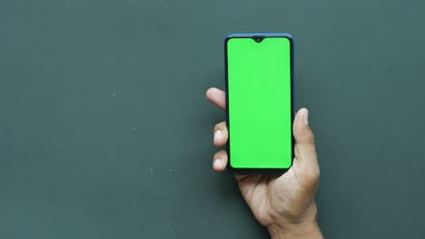 Close-up-of-young-man-hand-using-smart-phone