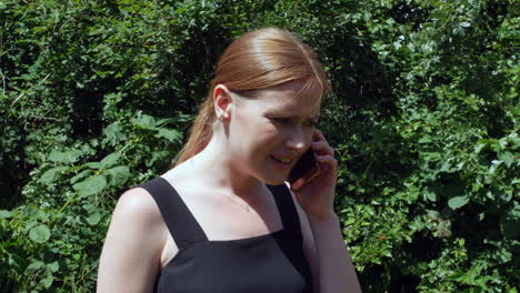 a girl with red hair is disappointed after receiving a phone call with bad news