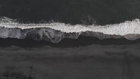 Waves-breaking-on-black-sand-beach-in-Iceland