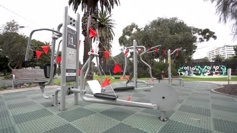 4k wide shot of roped off outdoor gym during pandemic lockdown