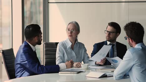 satisfied senior businesswoman young male investor reached agreement shake hands