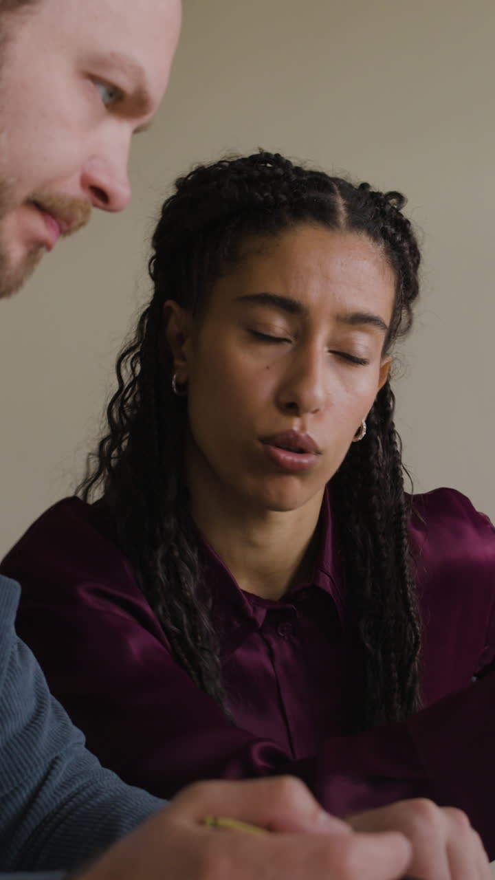 Two people engaged in a professional discussion or collaboration