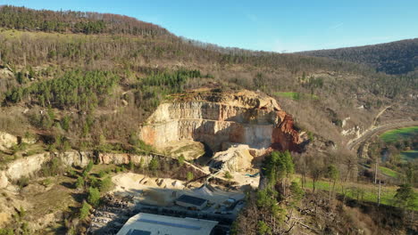 large industrial limestone quarry in liesberg at laufen on a sunny day