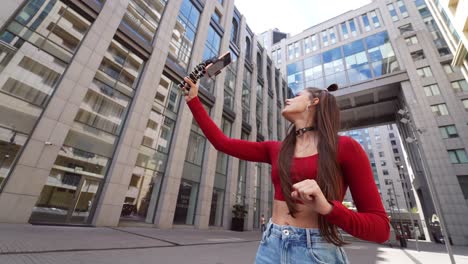 young woman taking a selfie in a city