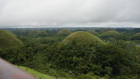 hand-held shot of large chocolate hills in the countryside of bohol, thailand