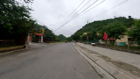 rural town through the highways along ha giang loop, ha giang province, vietnam. pov shot