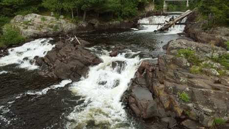 scenery of terraced waterfalls cascading over rocks of mountain river