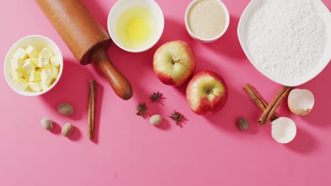 video of baking ingredients and tools lying on pink surface