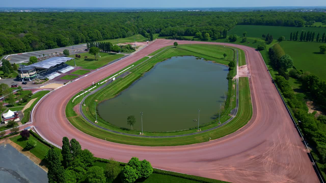 Hippodrome de Laval, racecourse with oval track and facilities, France. Aerial drone
