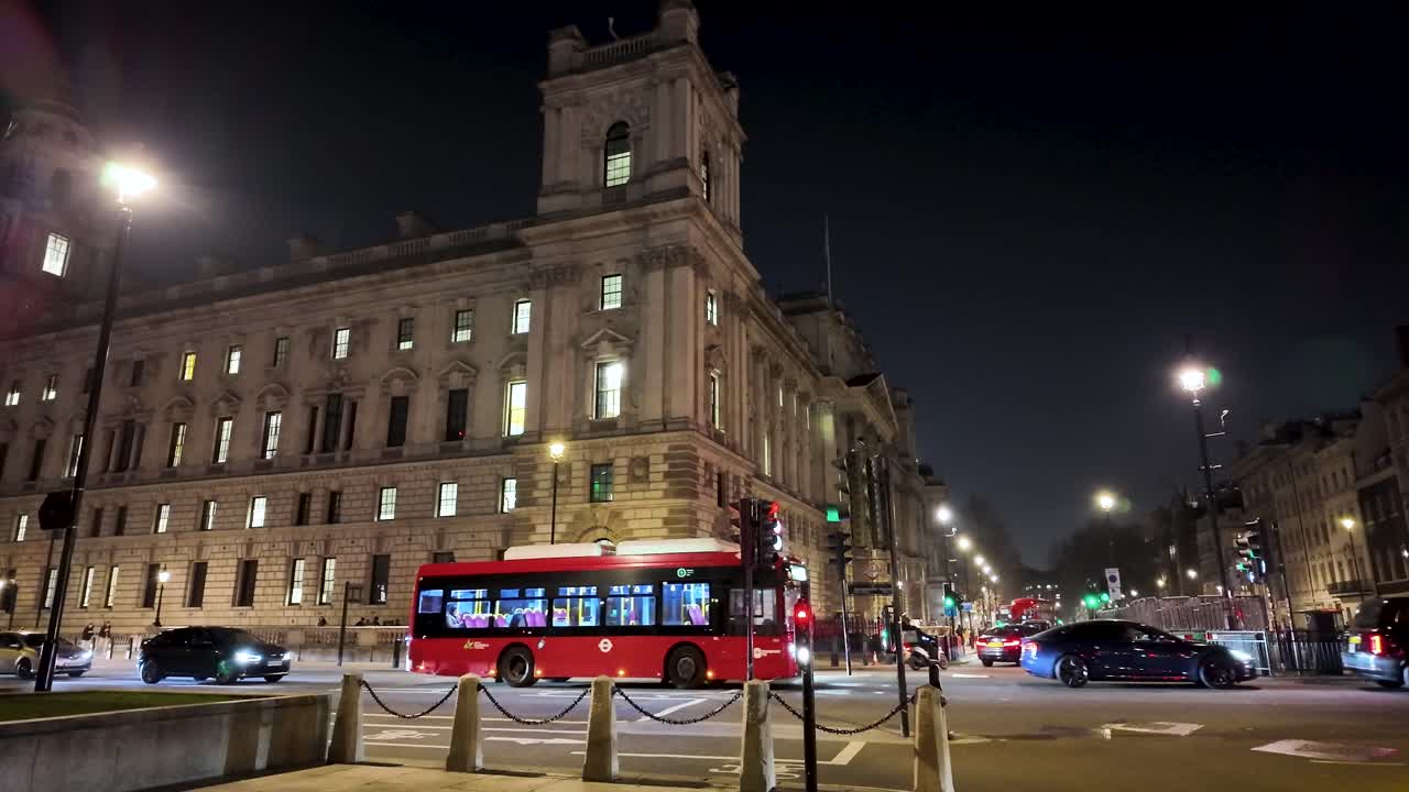 Static shot of nighttime traffic activity on the streets of central London, United Kingdom