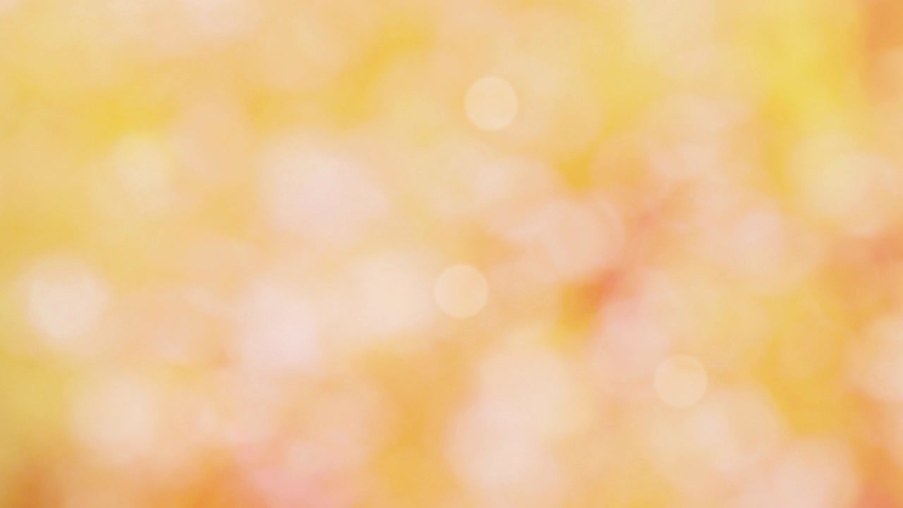 색 보케와 밝은 오렌지색 배경