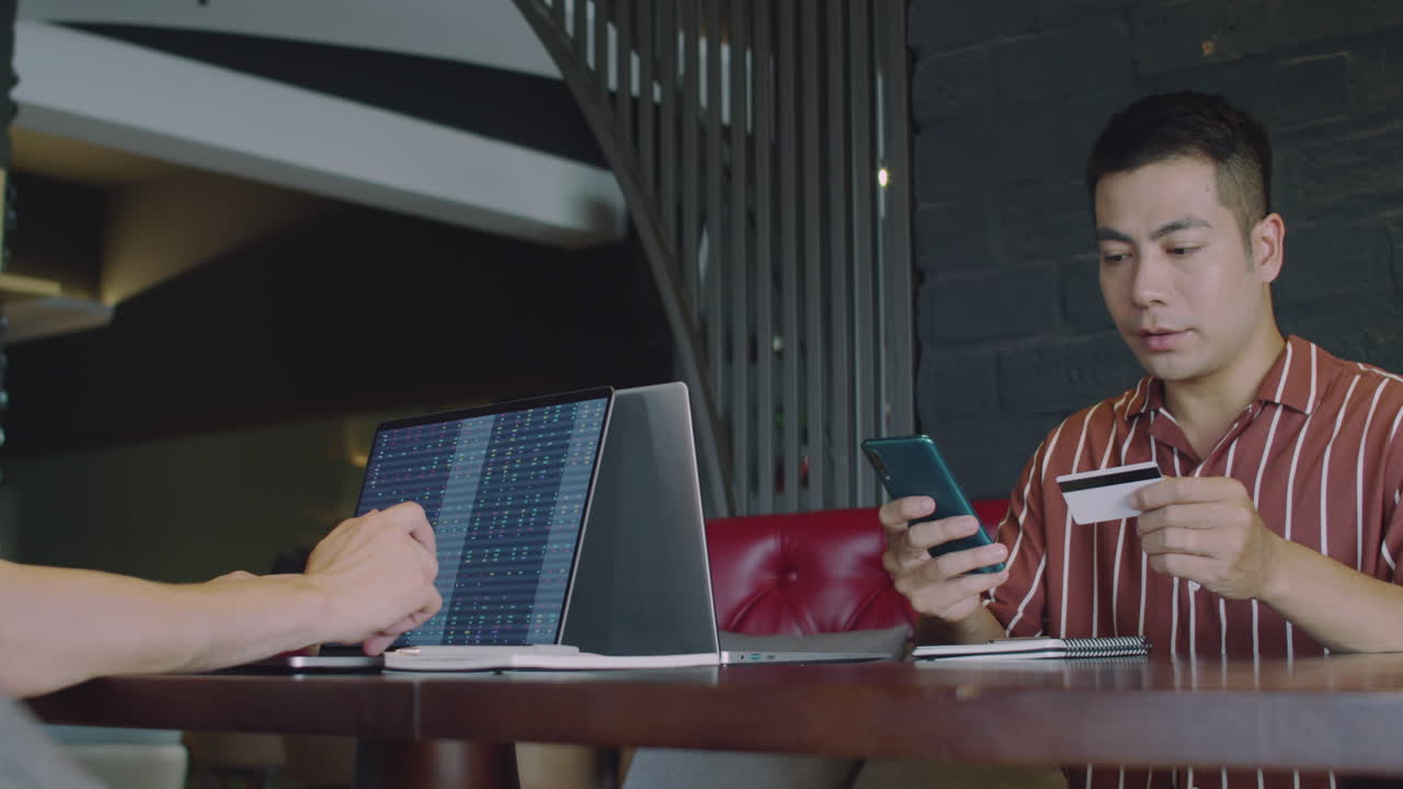 Businessman Withdrawing Money from Crypto Wallet to Credit Card