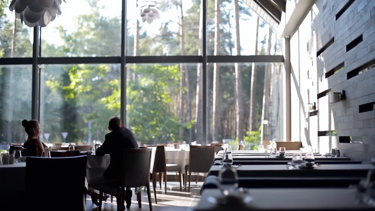 Man and woman eating them at the restaurant