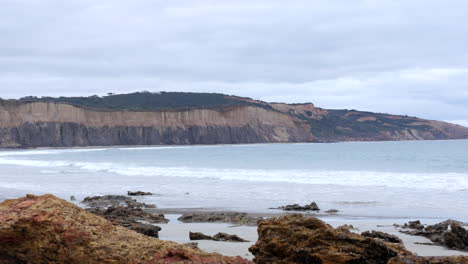 sandstone cliff face of an australian beach