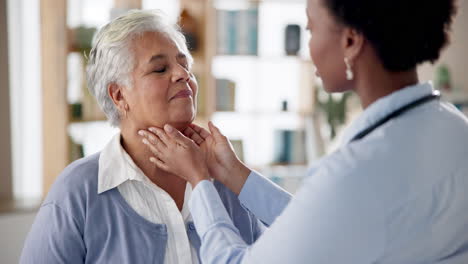 doctor examining elderly patient's thyroid