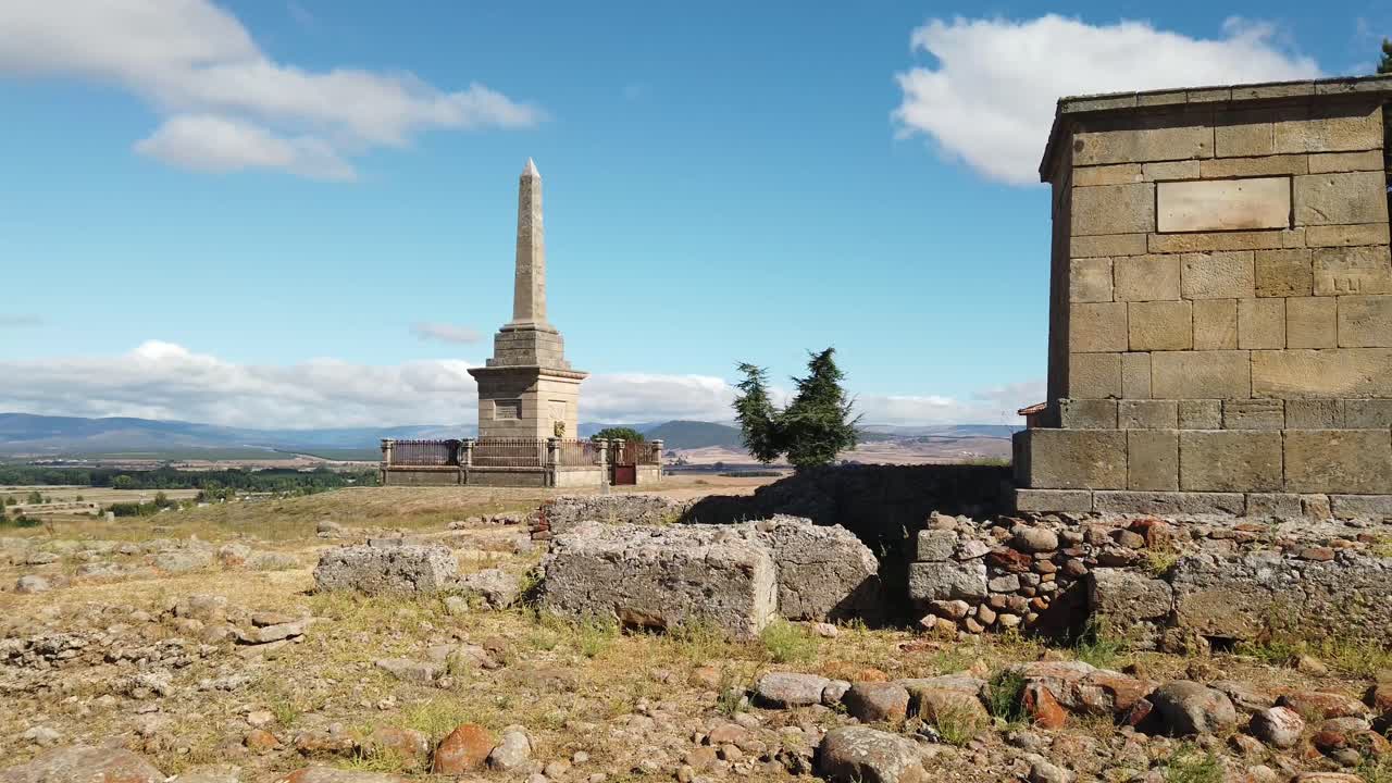 Roman ruins under a blue sky at Yacimiento archaeological site in Garray Spain