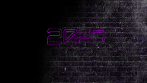 animación de texto de neón 2023 sobre una pared de ladrillo negro.