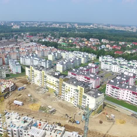 building materials and equipment are located on the site of the construction of modern high-rises. aerial view