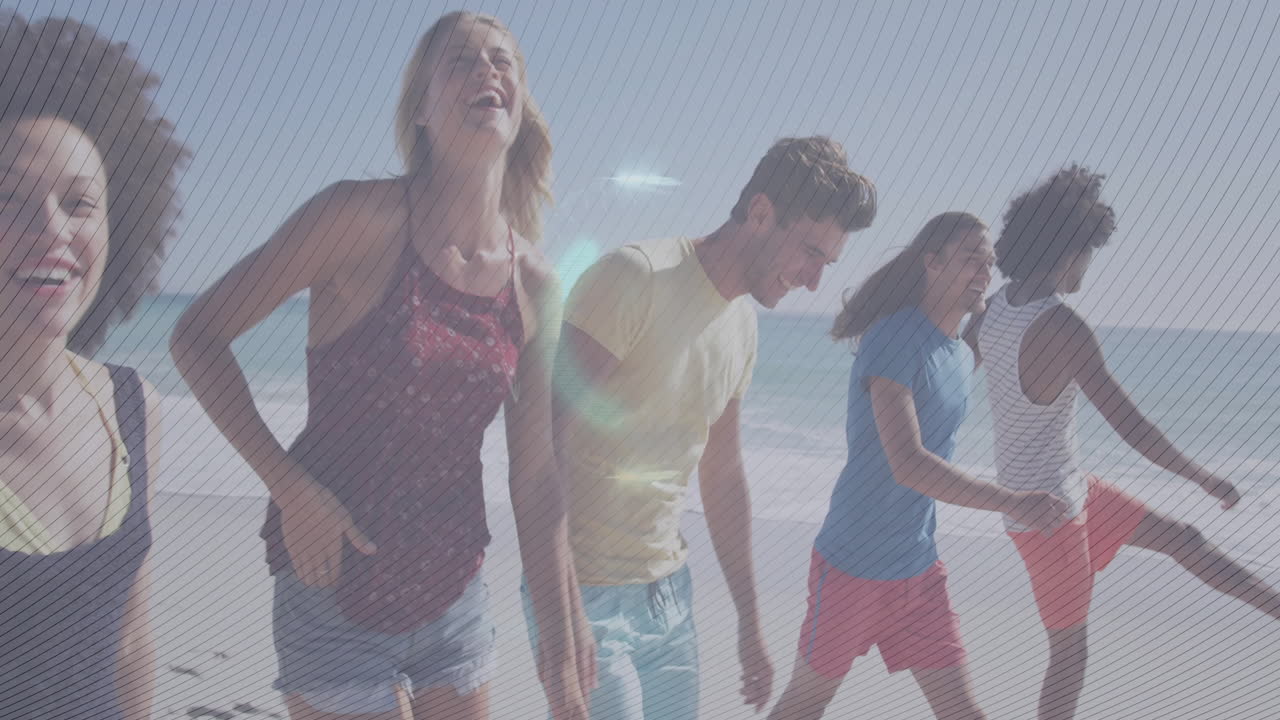 Group of friends running on beach with glowing animation over them