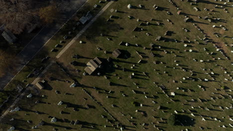 Aerial-birds-eye-overhead-top-down-view-of-rows-of-gravestones-on-historic-Calvary-Cemetery.-Queens,-New-York-City,-USA