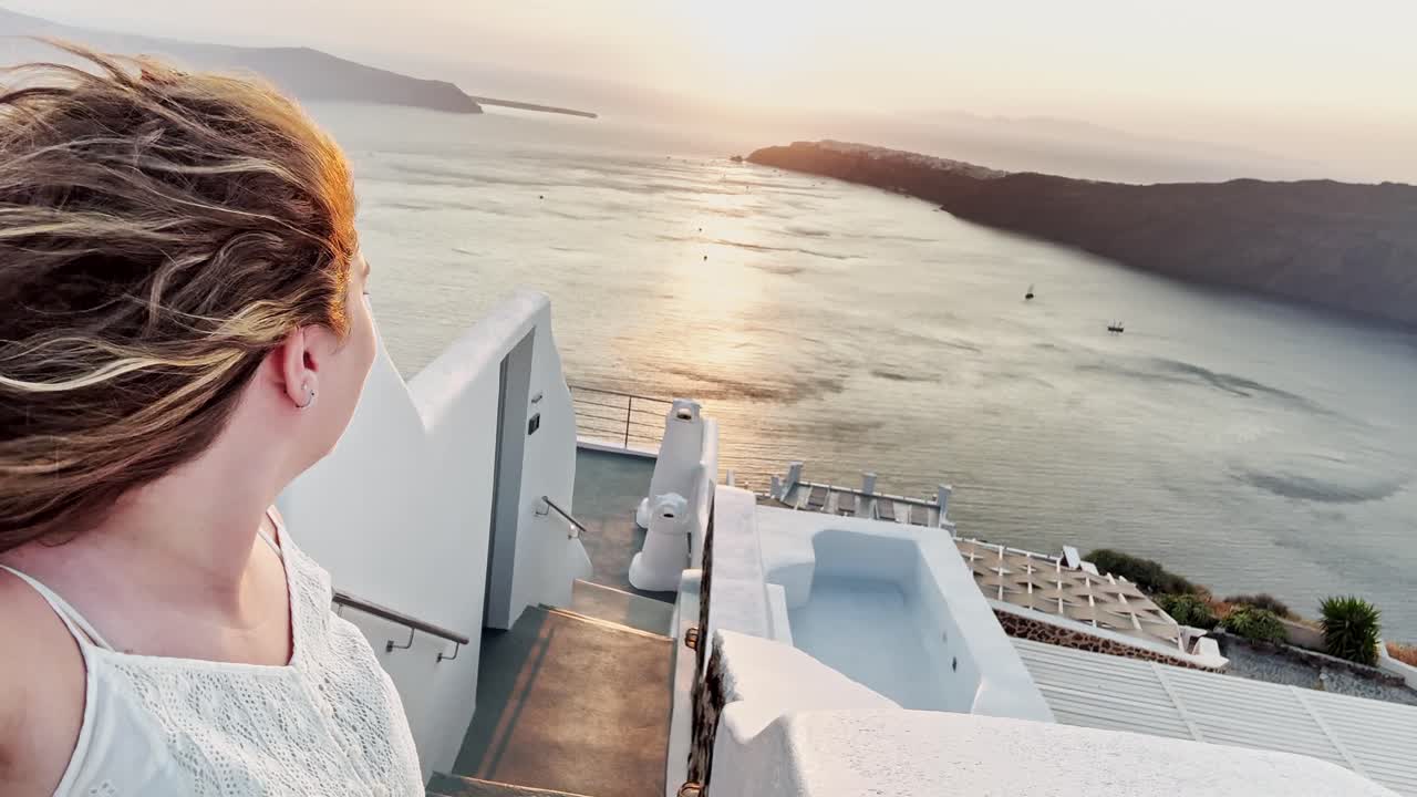 Woman Looking Towards Santorini Caldera at Sunset
