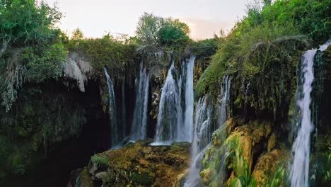 Closeup-Aerial-View-Of-Powerful-Waterfall-Among-Green-Tropical-Thicket