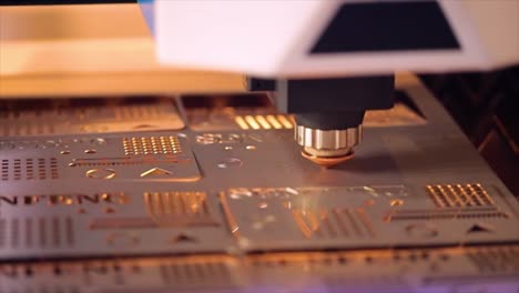 cnc laser cutting of metal in slow motion, modern industrial technology.