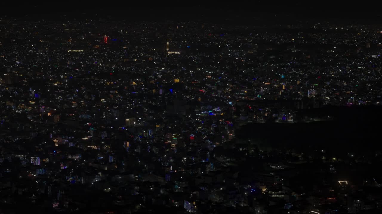 Beautiful drone footage of Kathmandu city at night during Diwali (Tihar), glowing with colorful lights, diyas, and decorations that reflect Nepal’s vibrant culture, joy, and festive celebration