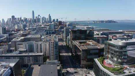 aerial shot flying over mission bay and 3rd street towards downtown san francisco