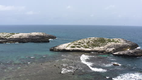 AERIAL---Islets-next-to-the-beach-of-Cayo-Lobos,-Fajardo,-Puerto-Rico,-circle-pan