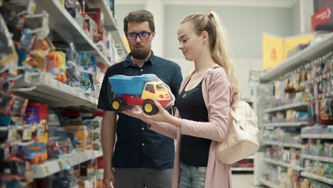 couple shopping for toys in a store