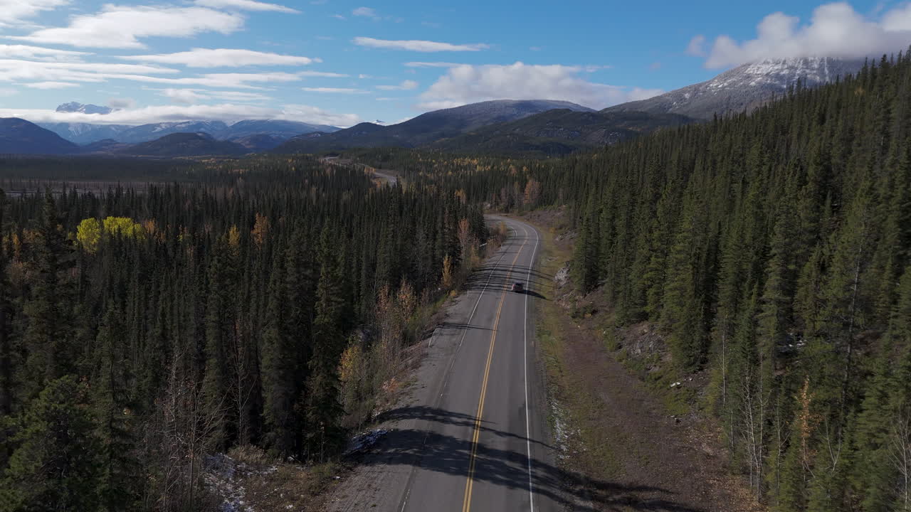 Vehicle cruising along Yukon’s remote Alaska Highway