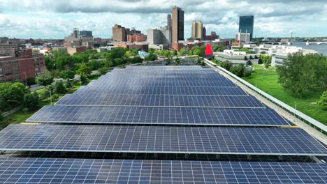 Large-solar-panel-array-above-parking-garage-outside-of-downtown-American-city