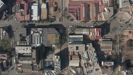 High-angle-view-of-square-blocks-of-houses-with-chamfered-corners-in-urban-district.-City-from-height.-Barcelona,-Spain