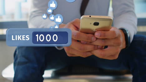 hombre enviando mensajes de texto en su teléfono mientras está sentado en la oficina 4k