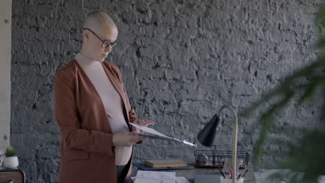 Pregnant Businesswoman Reviewing Documents