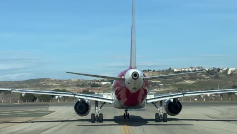 Rear-view-of-a-A320-taxiing-ahead-on-a-taxiway-ready-for-take-off