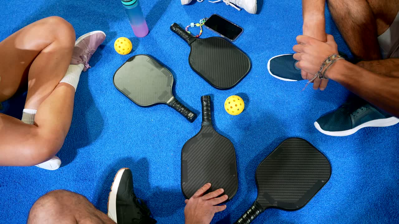 Overhead View of Pickleball Players Taking a Break on Court