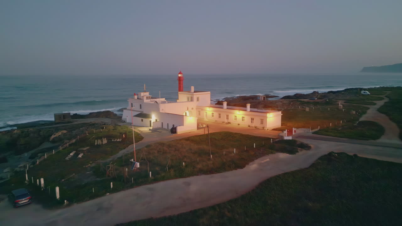 Beautiful lighthouse standing ocean coast at summer evening. Coastal building