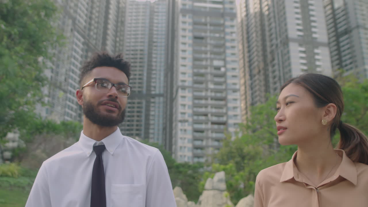 Colleagues Talking about Business during Walk