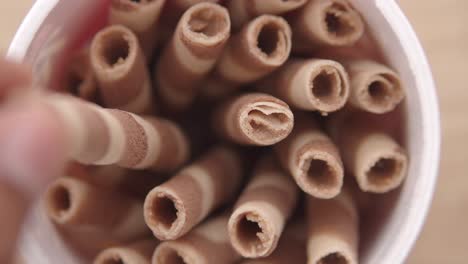 close-up of chocolate wafer rolls in a container